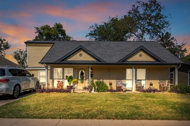 a view of a car park in front of house