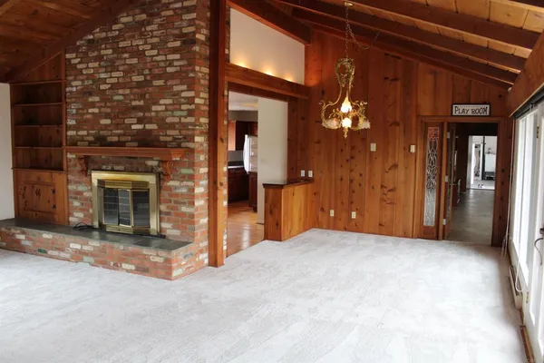a view of a hallway with a fireplace