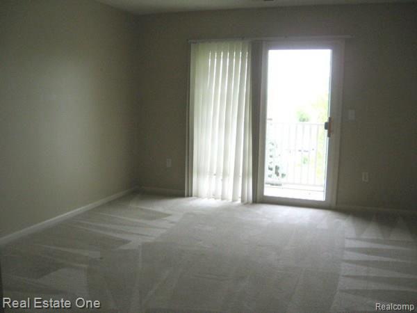 4145 Hampton Ridge Boulevard, Unit 32 Howell, MI 48843 - Photo 11 of 28 master bed 2.jpg
