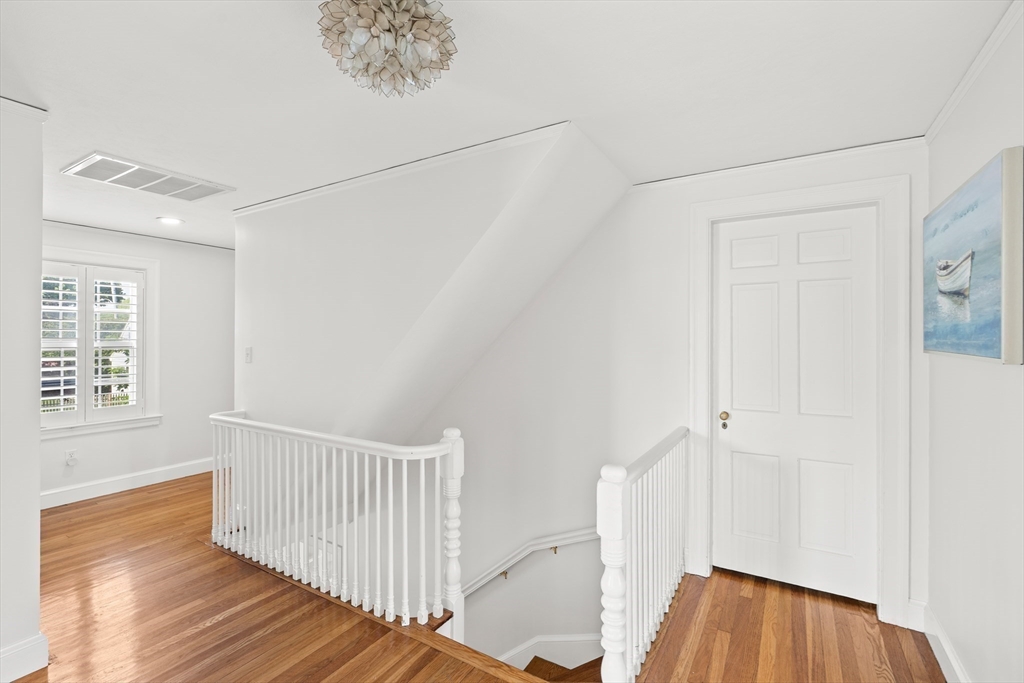 6 Shetland Road Marblehead, MA 01945 - Photo 18 of 39 a view of a hallway with wooden floor and entryway