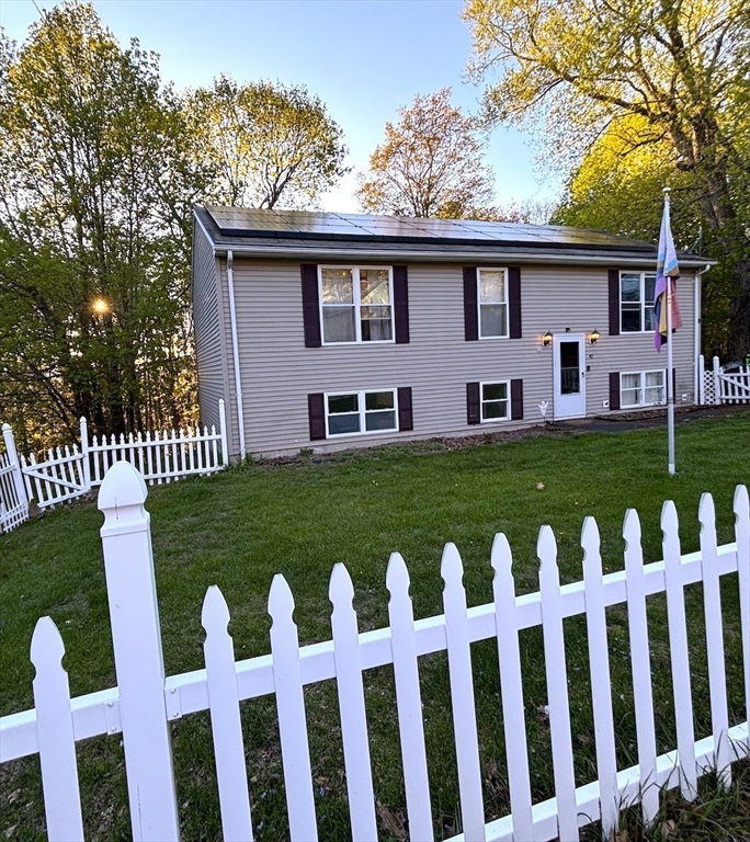 47 Grove Street Spencer, MA 01562 - Photo 1 of 27 a front view of a house with garden