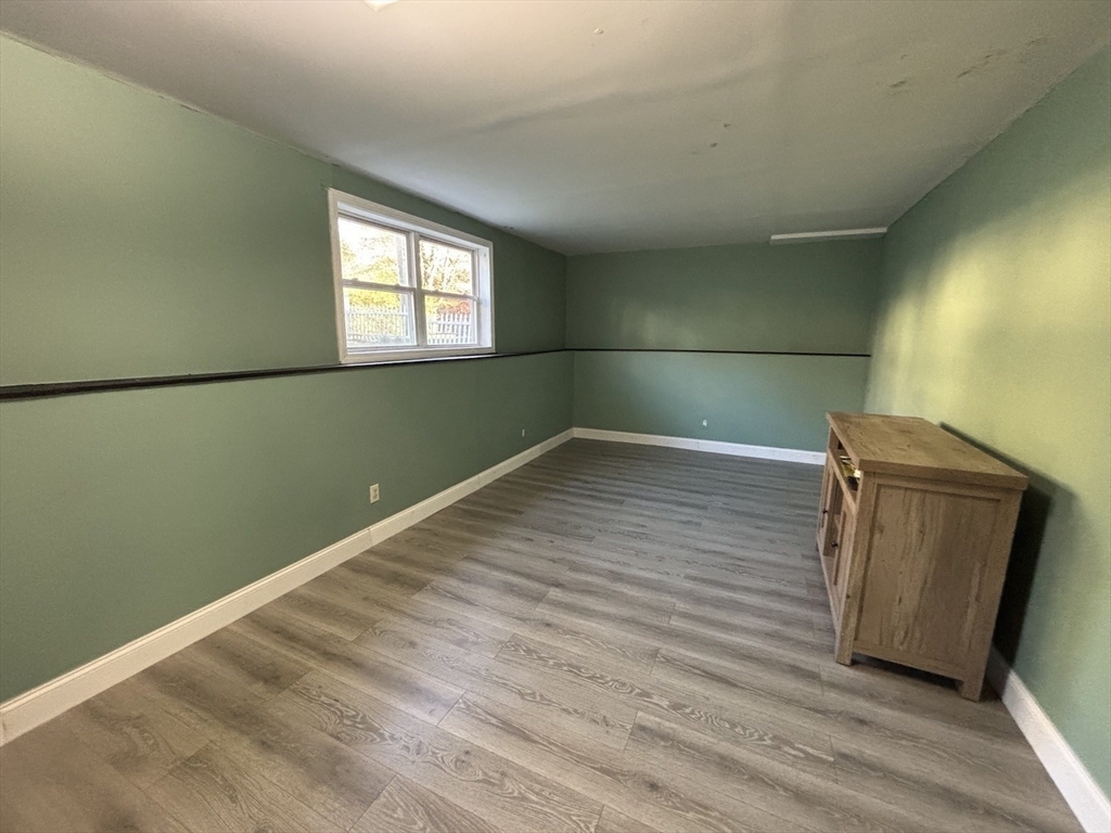 47 Grove Street Spencer, MA 01562 - Photo 14 of 27 a view of a room that has wooden floor and a window