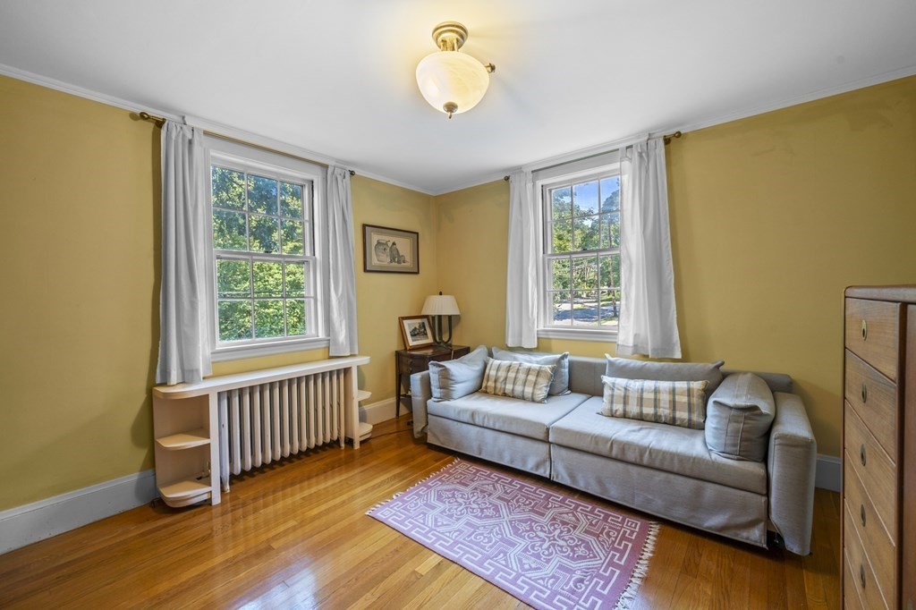 154 Mill Street Newton, MA 02459 - Photo 11 of 15 a bedroom with furniture and a window