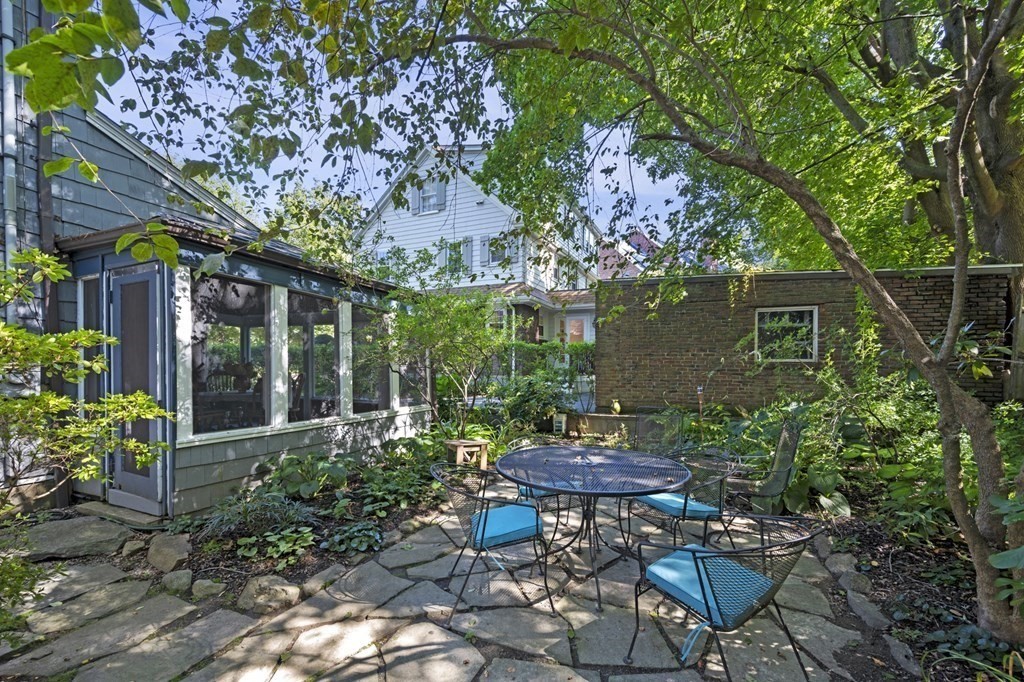154 Mill Street Newton, MA 02459 - Photo 14 of 15 a view of a table and chairs in backyard of the house