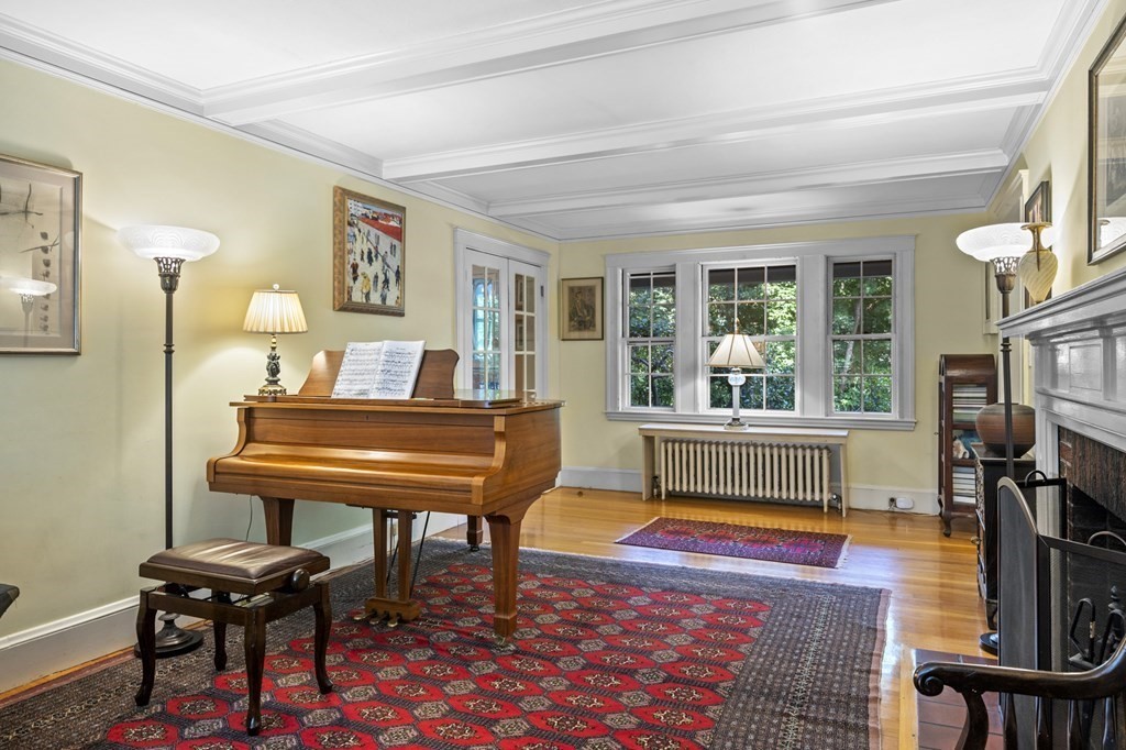 154 Mill Street Newton, MA 02459 - Photo 2 of 15 a living room with furniture a piano and a flat screen tv