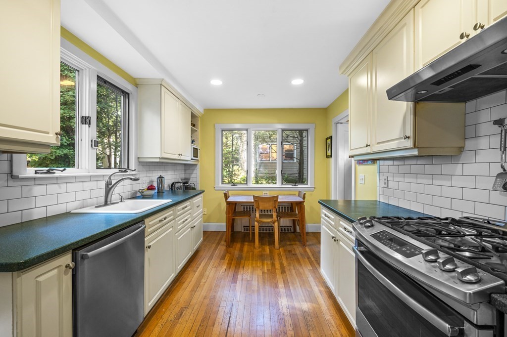 154 Mill Street Newton, MA 02459 - Photo 4 of 15 a kitchen with sink stove and wooden floor