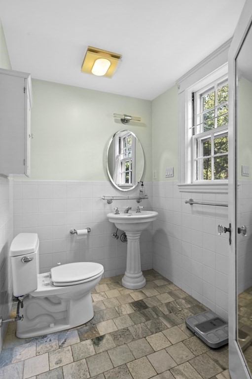 154 Mill Street Newton, MA 02459 - Photo 8 of 15 a view of bathroom with a toilet and a sink