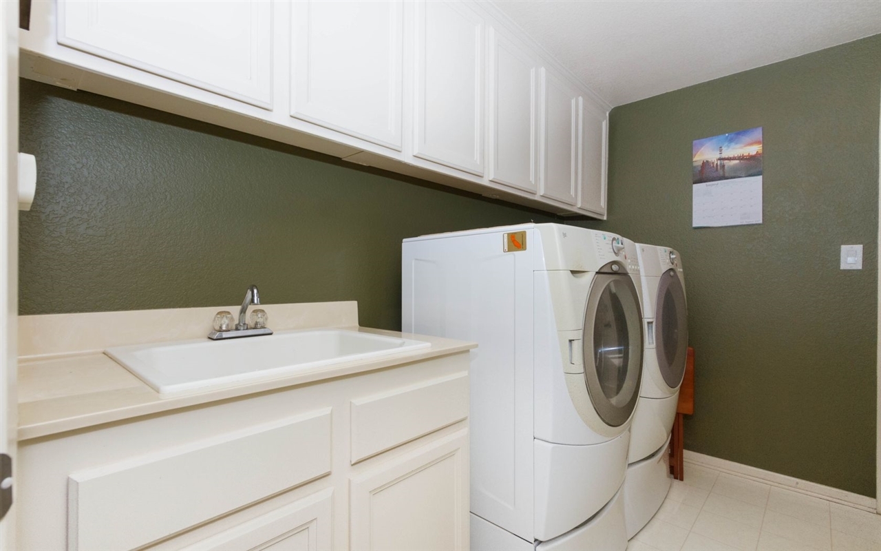 4309 Silver Spring Way Oceanside, CA 92057 - Photo 12 of 25 Laundry Room with Extra Cabinetry and a large sink