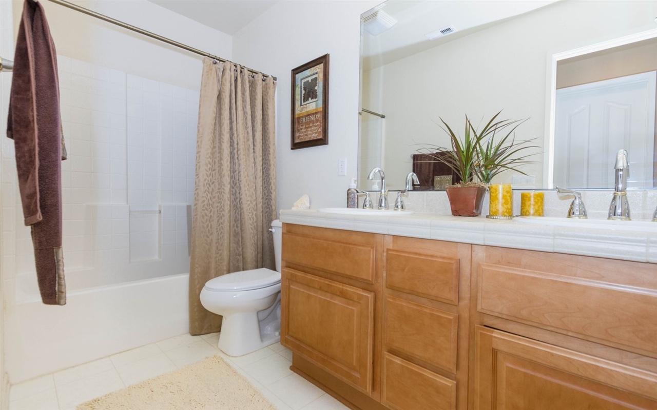 4309 Silver Spring Way Oceanside, CA 92057 - Photo 24 of 25 Upstairs Bathroom with His and Hers Sinks