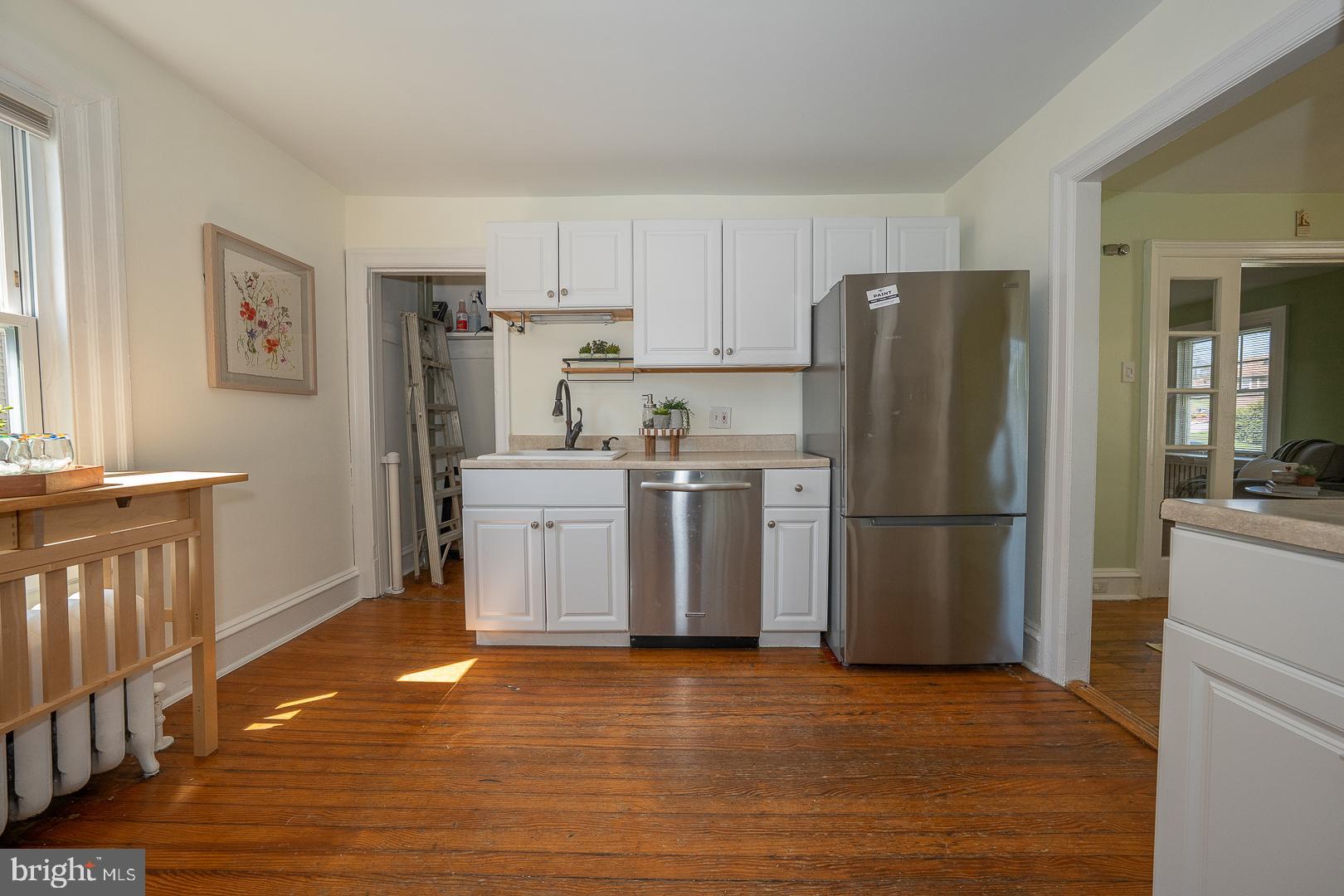 275 Old Eagle School Road Wayne, PA 19087 - Photo 20 of 47 a kitchen with a refrigerator sink and cabinets