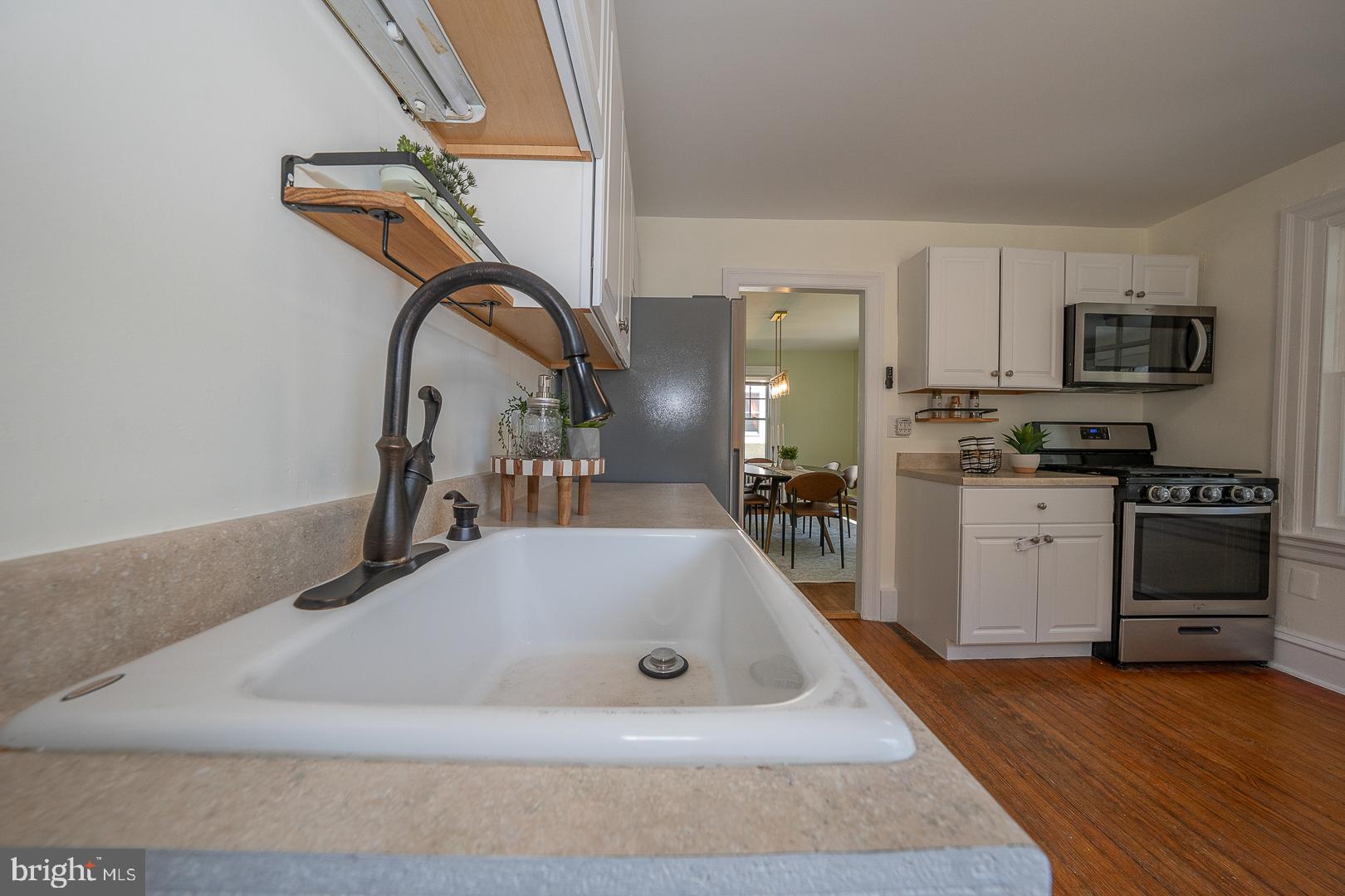 275 Old Eagle School Road Wayne, PA 19087 - Photo 22 of 47 a kitchen with stainless steel appliances granite countertop a sink a stove and a refrigerator