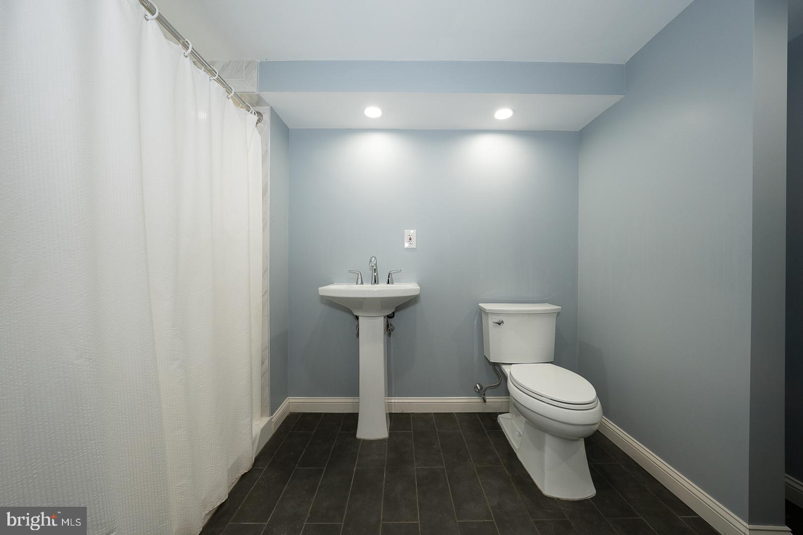 275 Old Eagle School Road Wayne, PA 19087 - Photo 26 of 47 a bathroom with a sink and a toilet