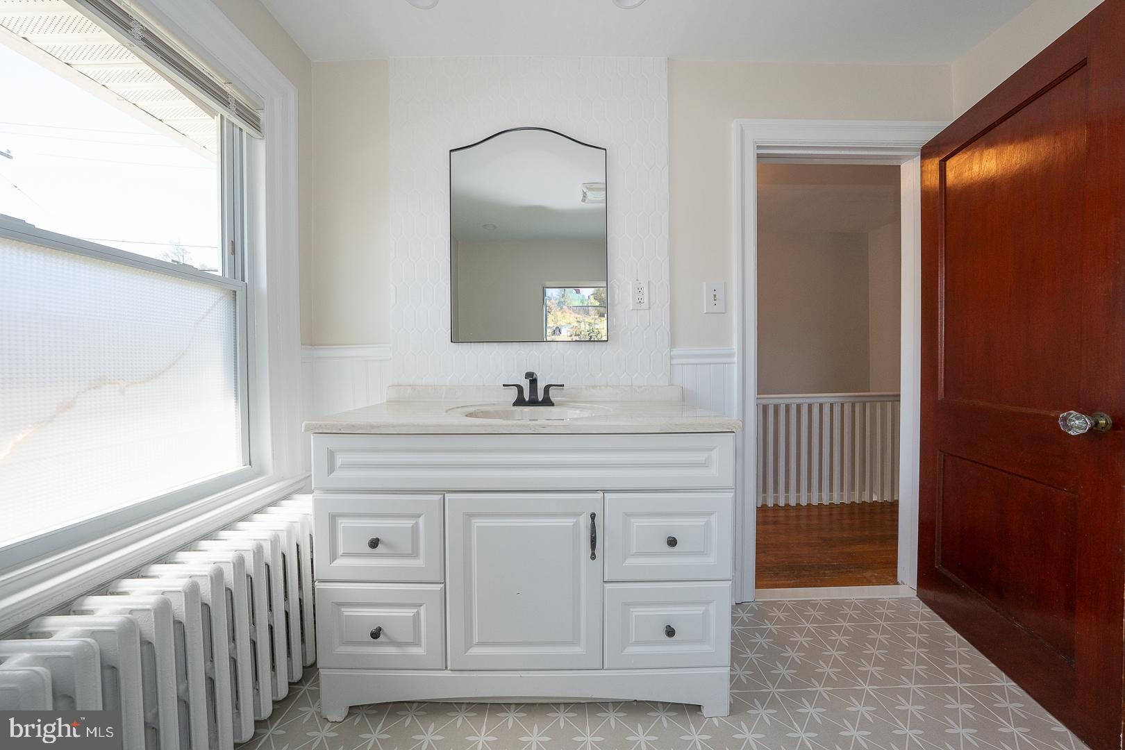 275 Old Eagle School Road Wayne, PA 19087 - Photo 32 of 47 a bathroom with a sink a mirror and a vanity