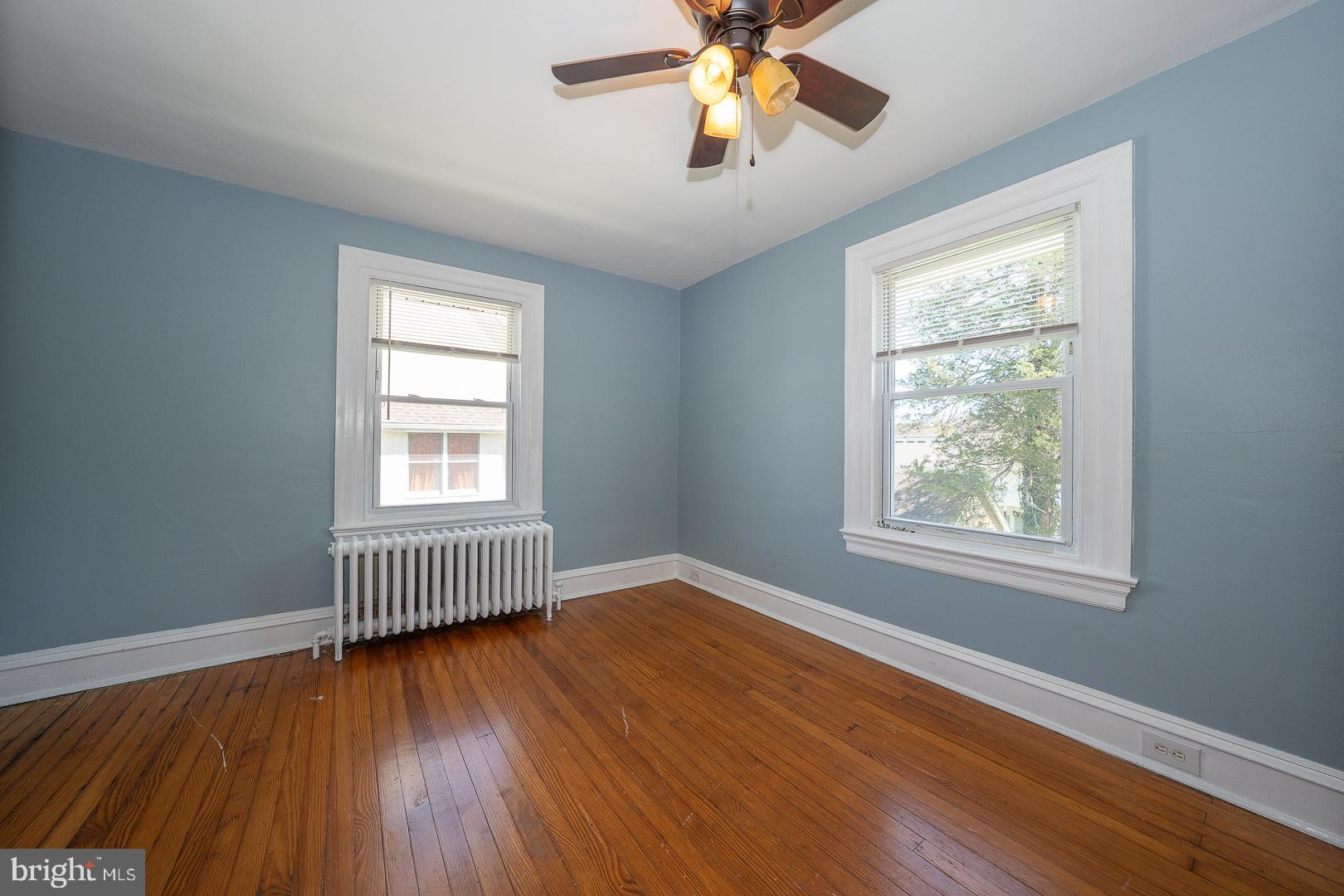 275 Old Eagle School Road Wayne, PA 19087 - Photo 35 of 47 a view of empty room with wooden floor and fan