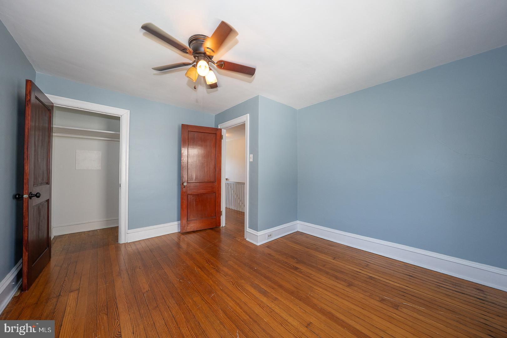 275 Old Eagle School Road Wayne, PA 19087 - Photo 36 of 47 an empty room with wooden floor a ceiling fan and closet