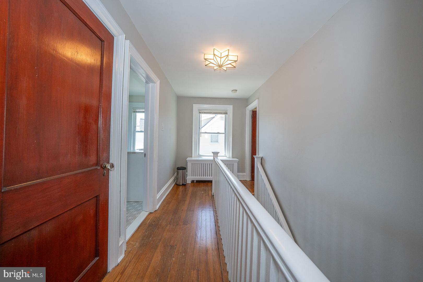 275 Old Eagle School Road Wayne, PA 19087 - Photo 39 of 47 a view of a hallway with wooden floor and staircase