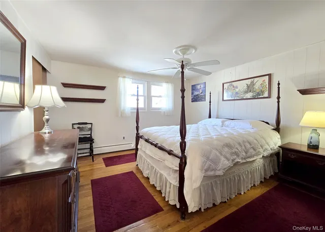 a bedroom with a bed and a lamp on table