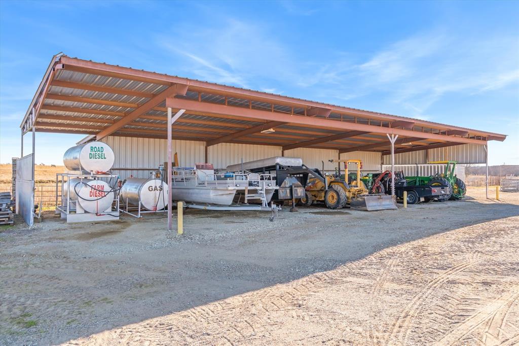 1700 Fm 1995 Van, TX 75790 - Photo 22 of 40 a view of a patio with table and chairs under an umbrella