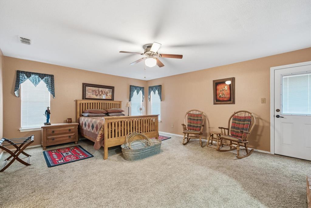 1700 Fm 1995 Van, TX 75790 - Photo 34 of 40 a bedroom with furniture and a chandelier