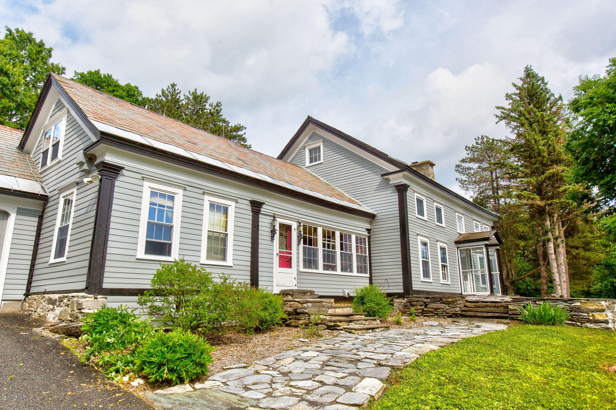 246 Whitman Road Hancock, MA 01267 - Photo 3 of 38 a front view of a house with garden