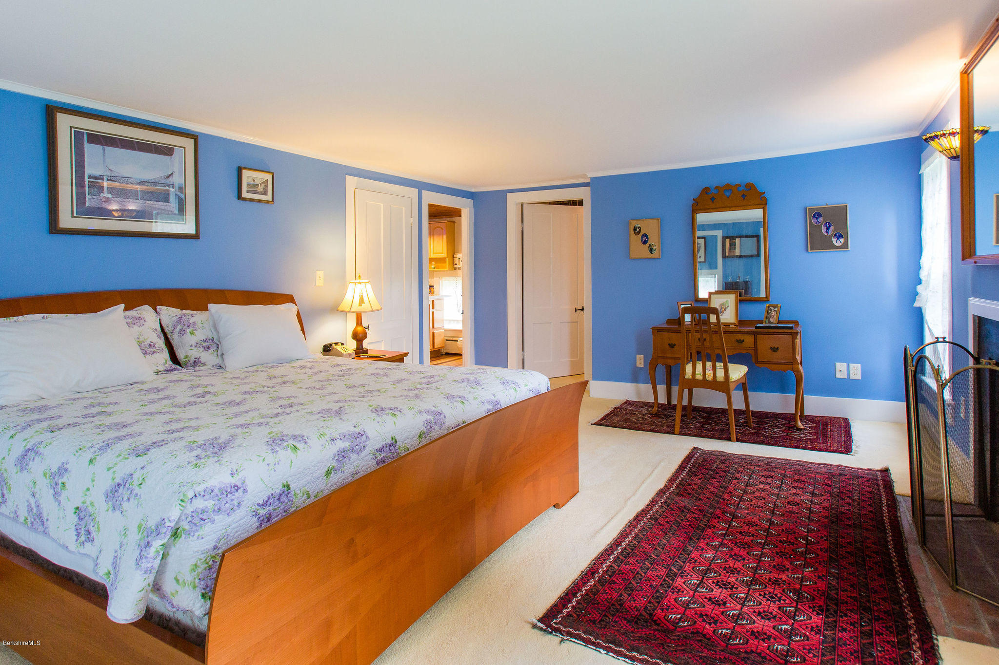 246 Whitman Road Hancock, MA 01267 - Photo 21 of 38 a bed sitting in a bedroom next to a window
