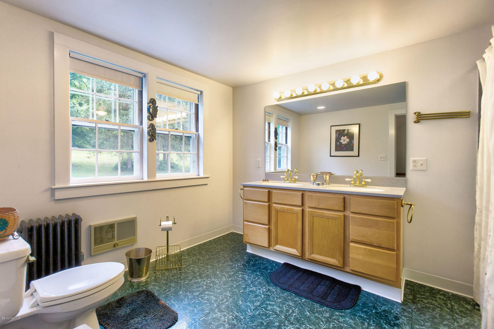 246 Whitman Road Hancock, MA 01267 - Photo 29 of 38 a spacious bathroom with a granite countertop toilet sink and mirror