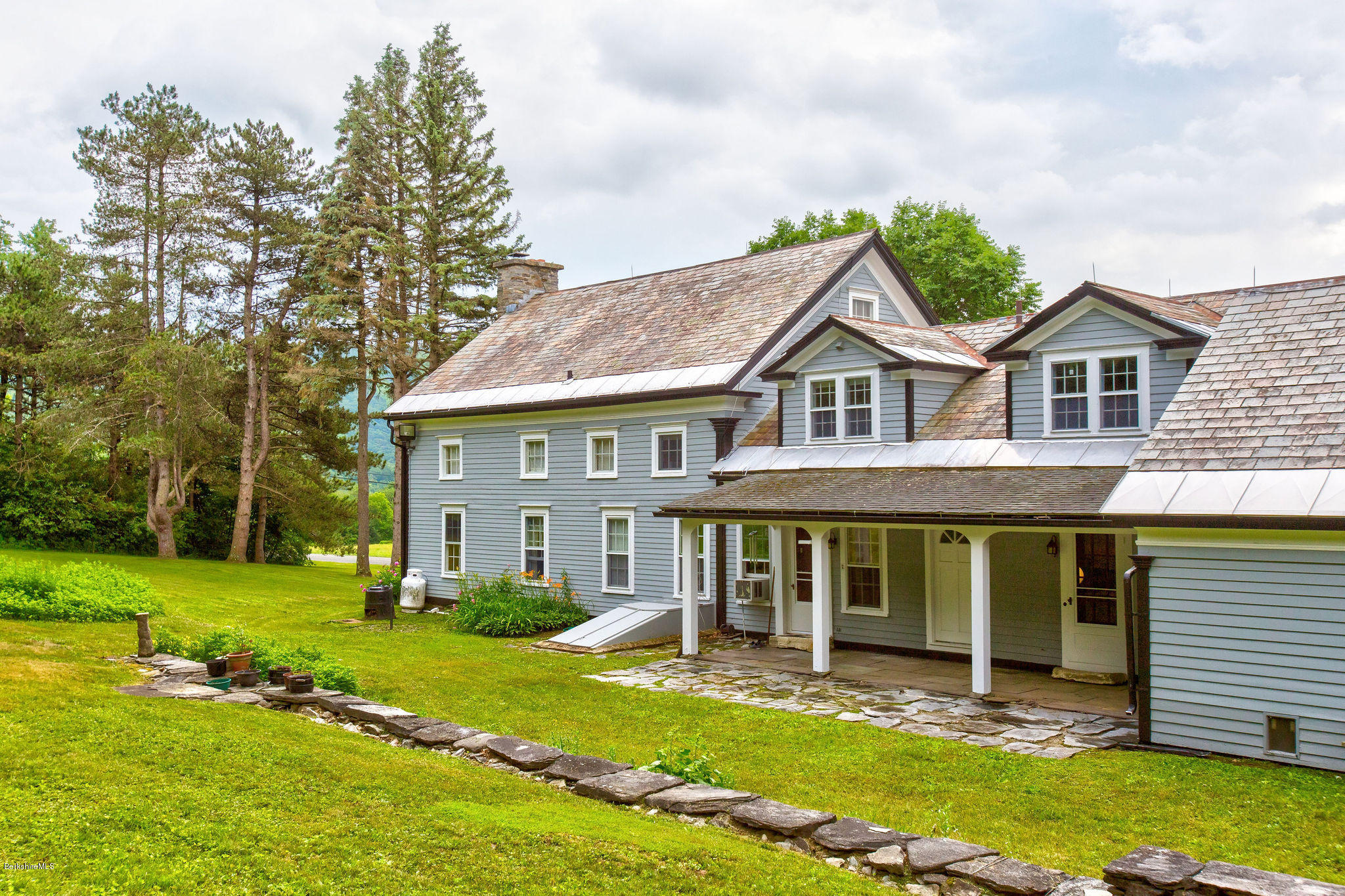 246 Whitman Road Hancock, MA 01267 - Photo 5 of 38 front view of a house with a yard