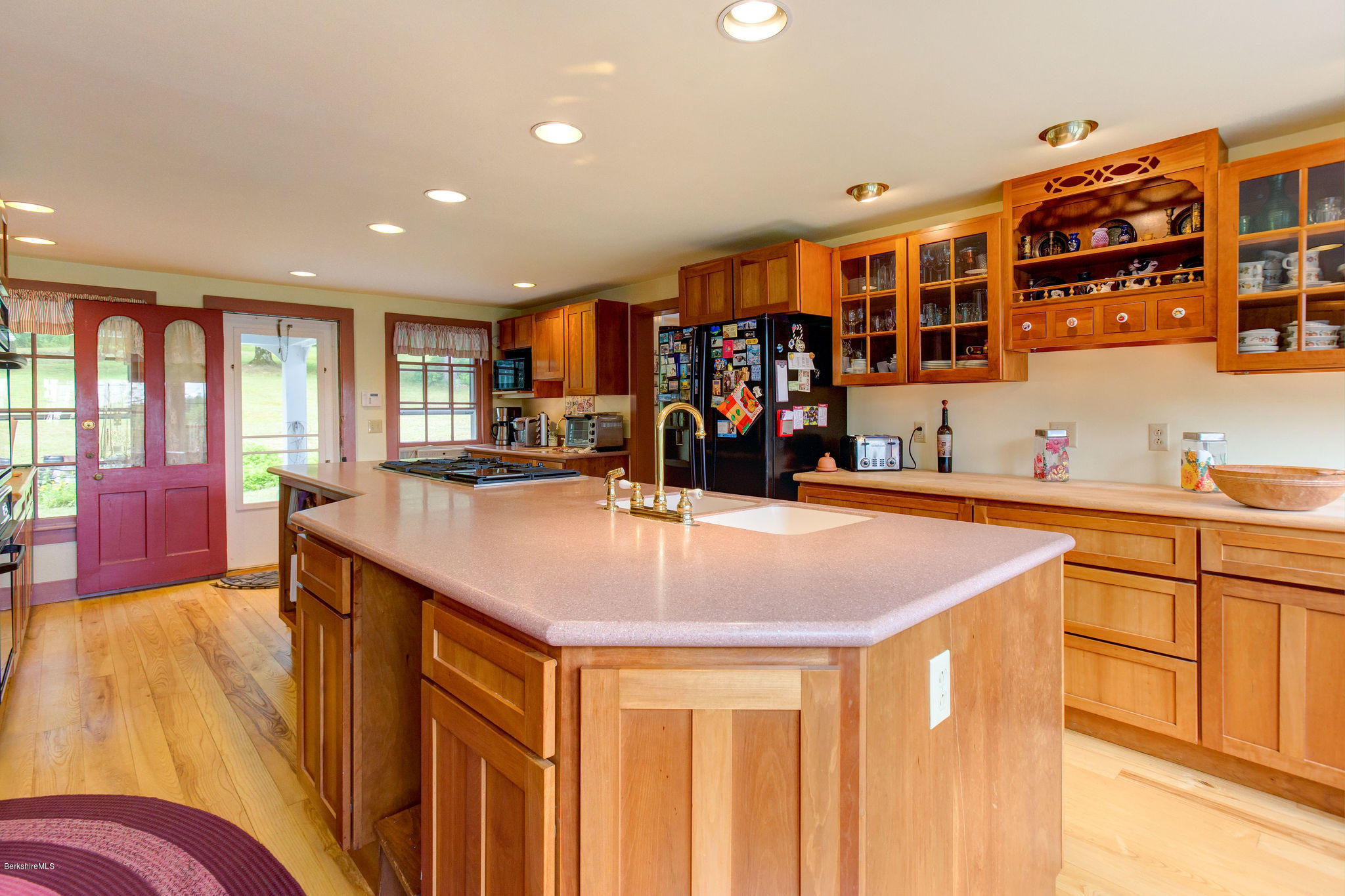 246 Whitman Road Hancock, MA 01267 - Photo 6 of 38 a kitchen with stainless steel appliances granite countertop a sink and cabinets