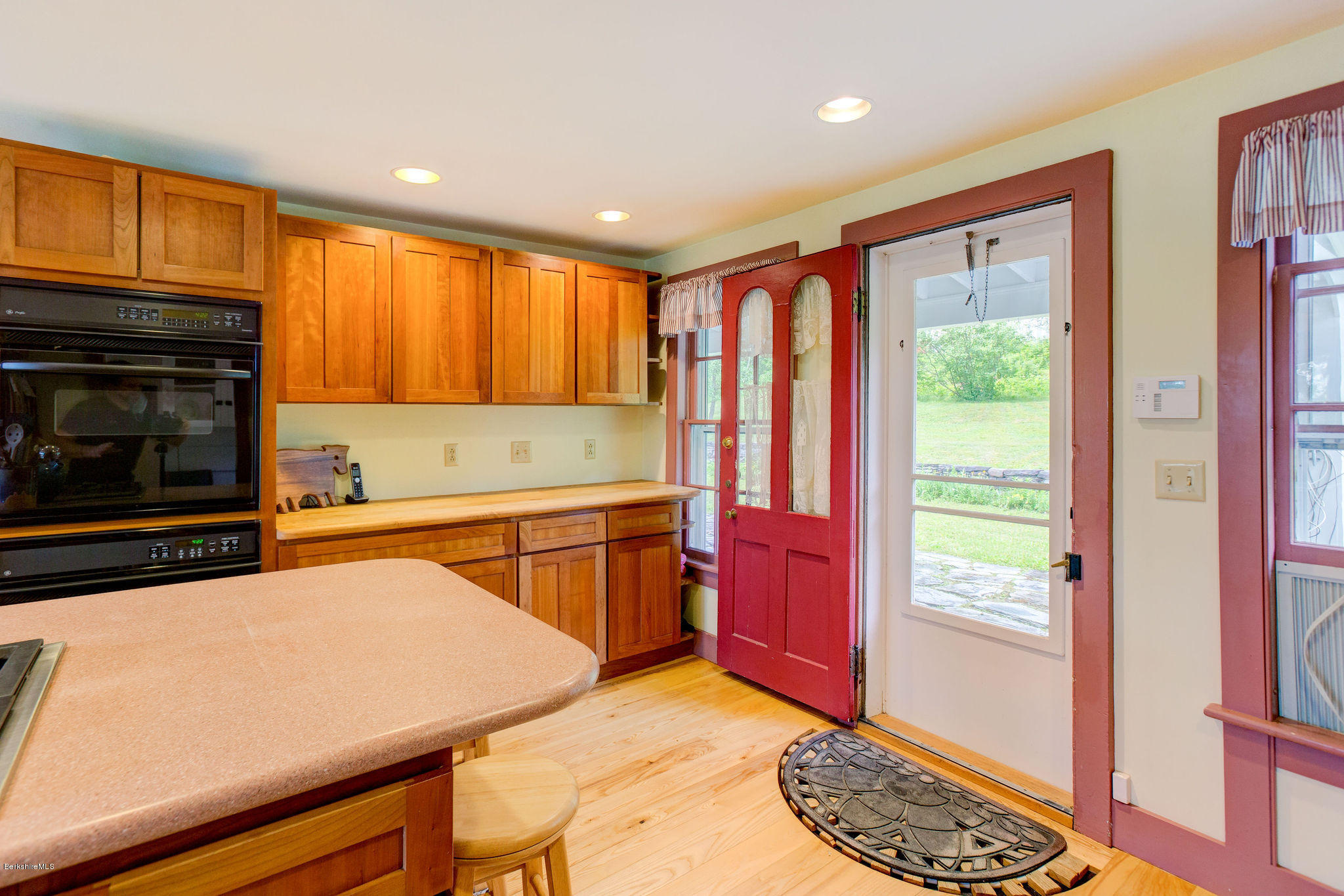 246 Whitman Road Hancock, MA 01267 - Photo 10 of 38 a kitchen with stainless steel appliances granite countertop a stove a sink and a microwave