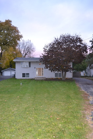 a view of a house with a garden