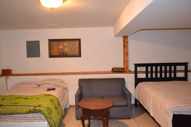 1S205 Valley Road Lombard, IL 60148 - Photo 15 of 21 a bedroom with a bed and chair