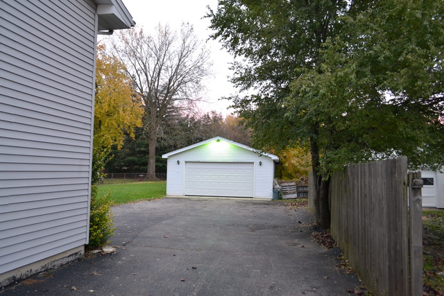 1S205 Valley Road Lombard, IL 60148 - Photo 19 of 21 a view of a house with a yard and large tree