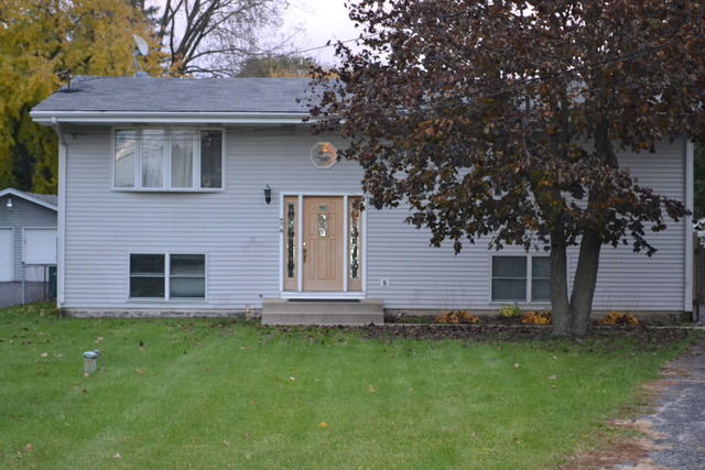 1S205 Valley Road Lombard, IL 60148 - Photo 2 of 21 a view of a house with a yard