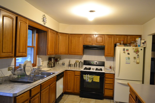 1S205 Valley Road Lombard, IL 60148 - Photo 7 of 21 a kitchen with stainless steel appliances granite countertop a refrigerator a stove and a sink
