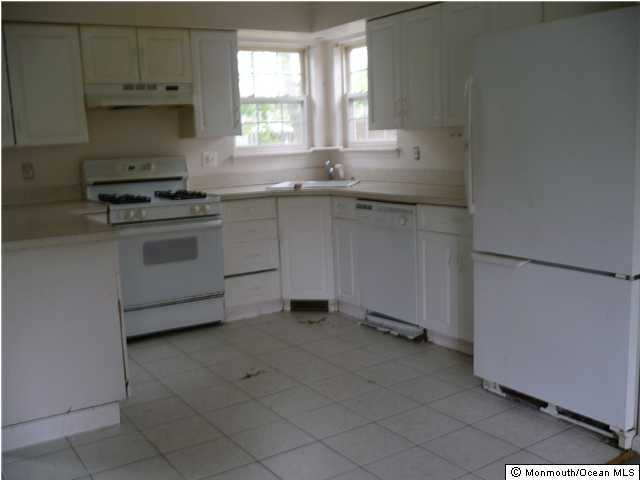 11 Amherst Road Toms River, NJ 08757 - Photo 3 of 3 a kitchen with stainless steel appliances a sink stove and cabinets