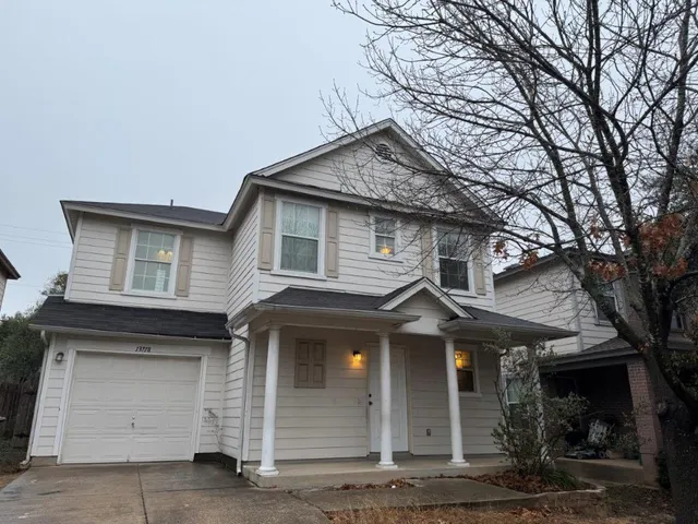 a front view of a house with garage
