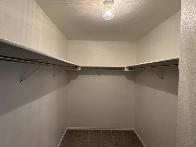 a view of a room with shelf on the wall