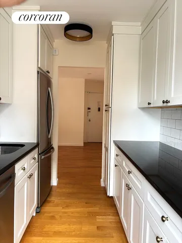 a white refrigerator freezer sitting in a kitchen