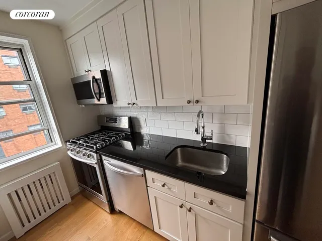 a bathroom with a sink a toilet and tub