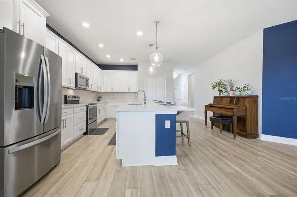 a view of a dining room with furniture and wooden floor