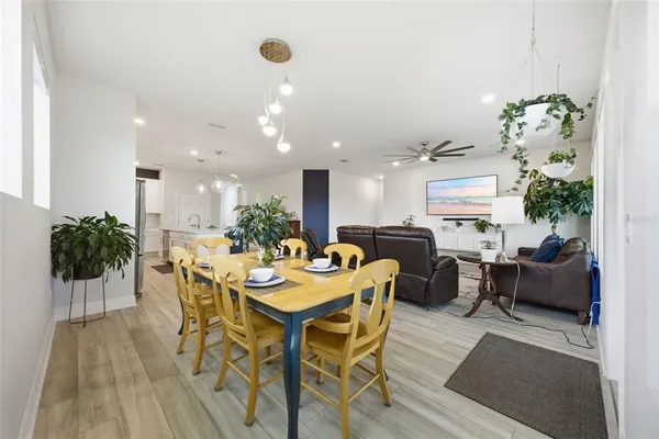 a bedroom with a bed and a flat tv screen on dresser