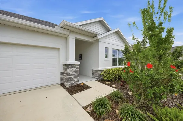 a view of livingroom with hardwood floor and a hallway