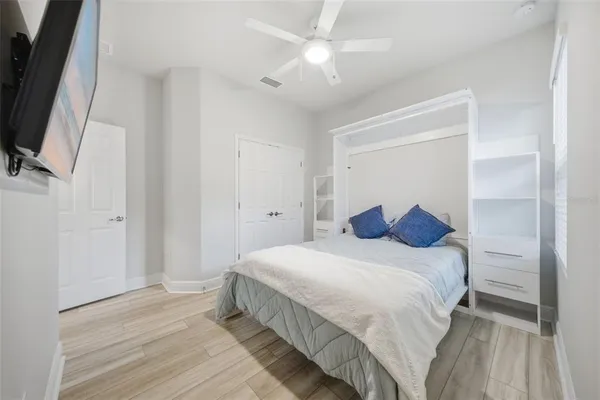 a bedroom with a large bed and a window