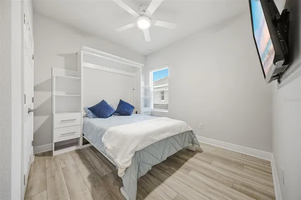 a bedroom with a bed and a walk in closet