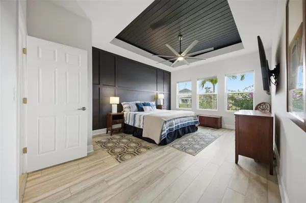 a bathroom with a sink a toilet and shower curtain