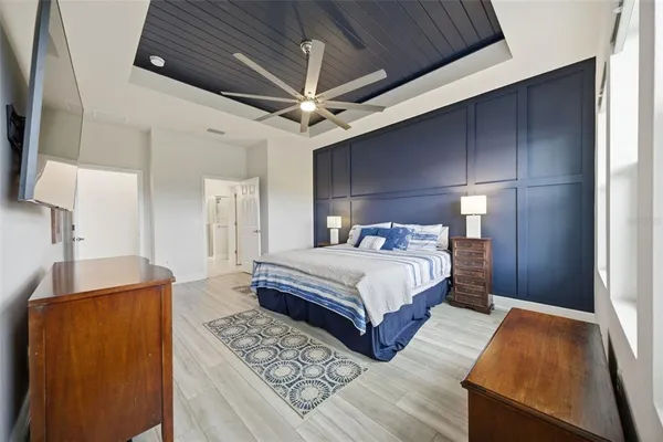 a bathroom with a granite countertop sink toilet and a mirror