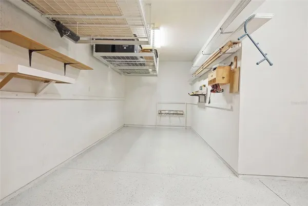 an aerial view of residential houses with outdoor space and swimming pool