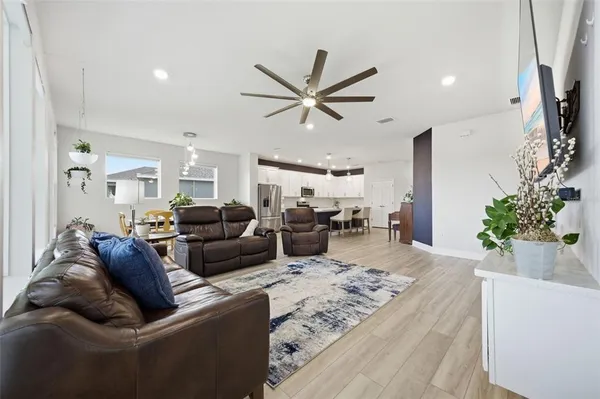 a kitchen with cabinets oven and a sink