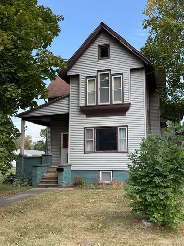 a front view of a house with a garage