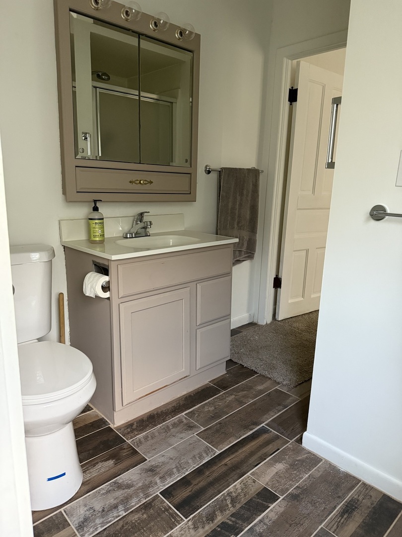 405 North Church Street Princeton, IL 61356 - Photo 17 of 24 a bathroom with a sink and a toilet